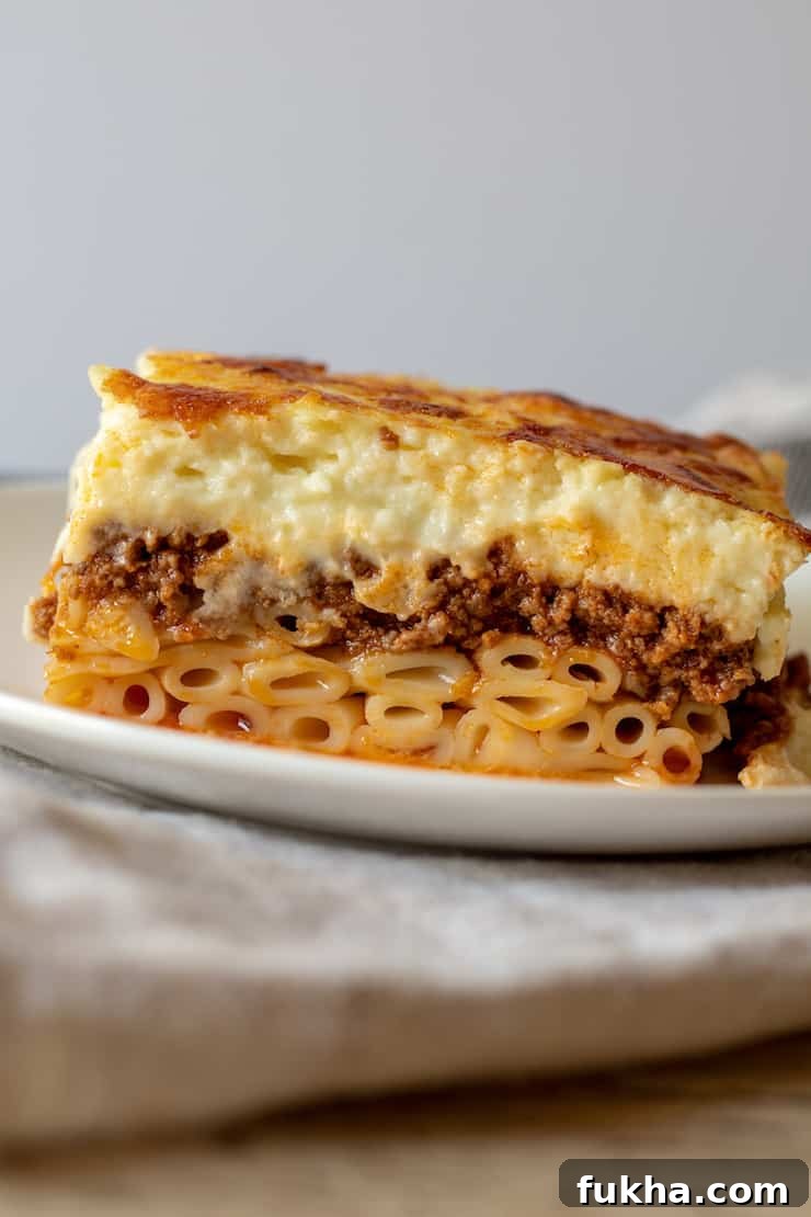 Pastitsio Recipe: Classic Greek Baked Pasta with Bechamel 2 Side view of a slice of pastitsio.