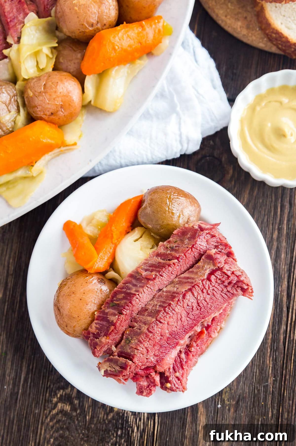 An overhead image of corned beef and veggies on a plate
