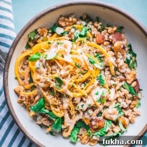 grain bowl with farro, butternut squash noodles, and fresh herbs
