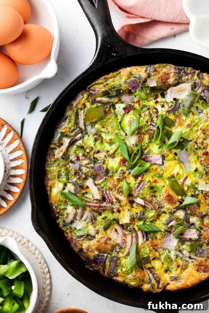 Keto Frittata keto frittata 1 egg frittata in a cast iron pan with fresh pepper on top