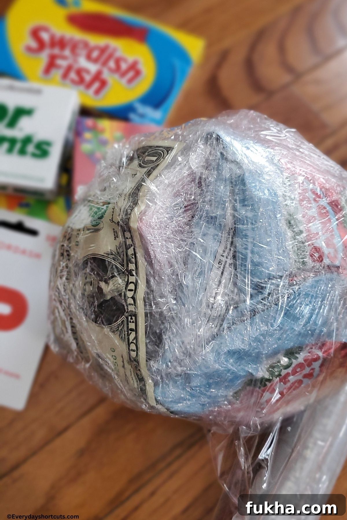 making the saran wrap ball with saran wrap and prizes