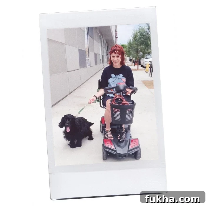 Paola with her dog Dedal in an electric scooter