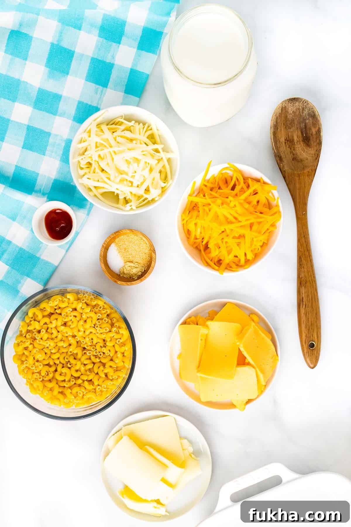 One-Pot No-Boil Mac and Cheese 3 No-Boil Macaroni and Cheese Ingredients: milk, salt, ground mustard, garlic powder, hot sauce, elbow macaroni, Velveeta cheese cut into thin slices, salted butter cut into thin slices, shredded cheddar, and shredded mozzarella.