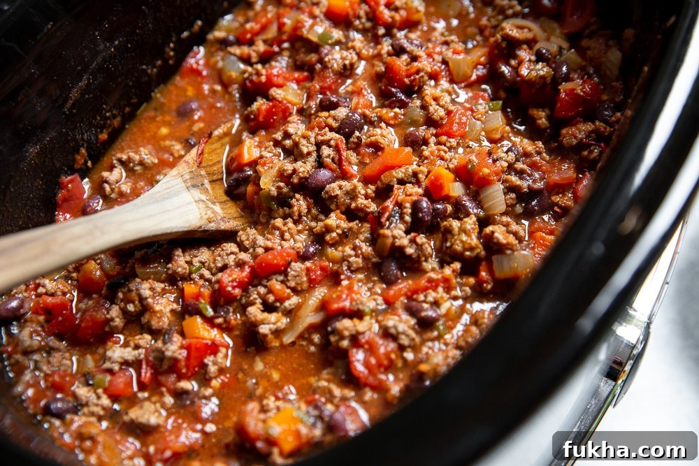 Slow-Cooker Beef Chili Recipe with Rich Smoky Flavor 6 Overhead shot of beef chili in the slow cooker.