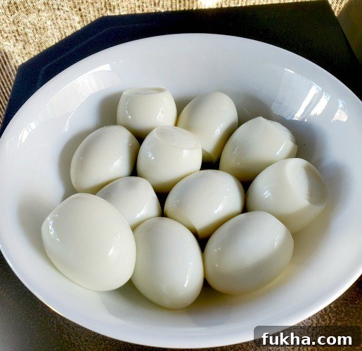 How to Smoke Hard-Boiled Eggs on a Pit Boss Pellet Smoker 3 Hardboiled Eggs Peeled in white bowl before smoking