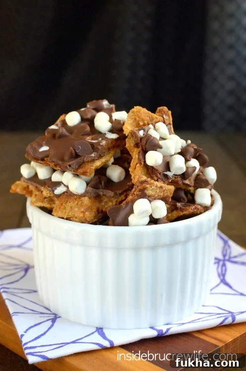 Golden grahams, chocolate, and mini marshmallows give this toffee bark a fun and delicious s'mores twist. Golden grahams, chocolate, and mini marshmallows give this toffee bark a fun and delicious s'mores twist.