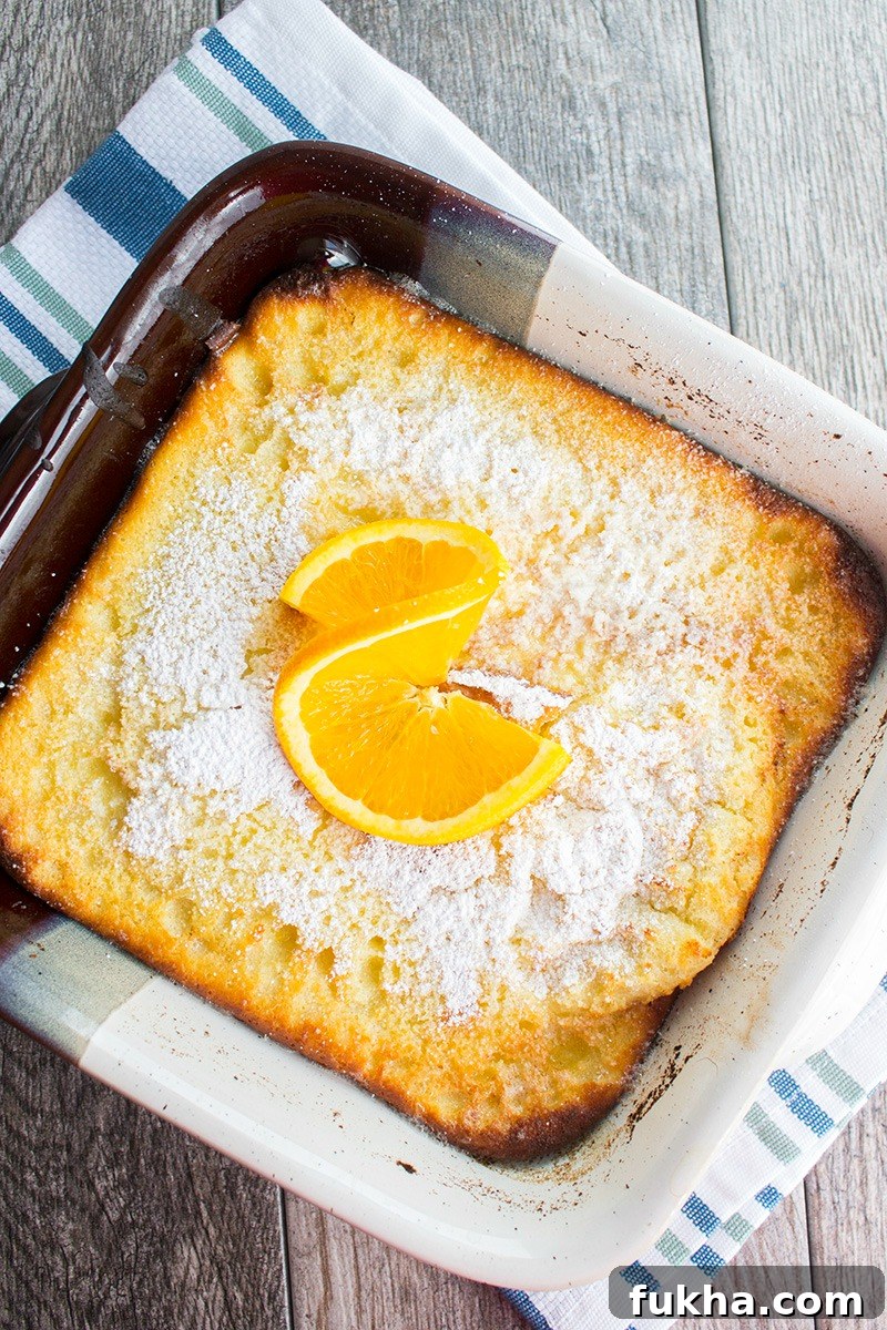 A classic breakfast dish bursting with citrus flavor, this Orange Ricotta Dutch Baby Recipe is a toothsome dish that'll leave everyone asking for seconds! orange ricotta dutch baby dusted with powdered sugar and an orange slice