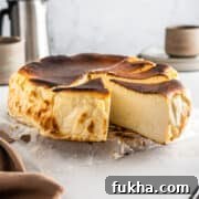 Sliced San Sebastian cheesecake on parchment paper.
