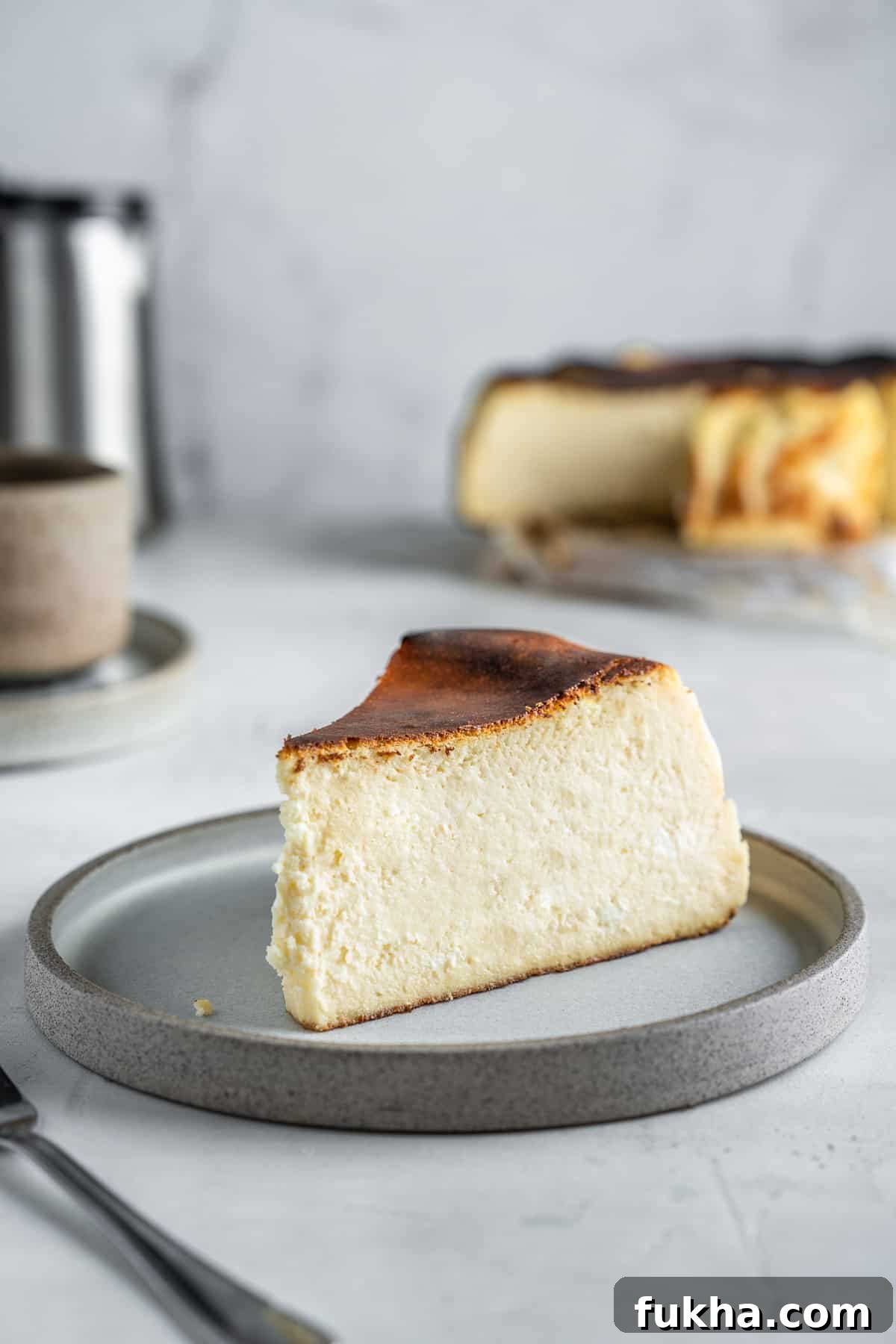 How to Make San Sebastian Burnt Basque Cheesecake 3 Slice of san Sebastian cheesecake on a dessert plate.