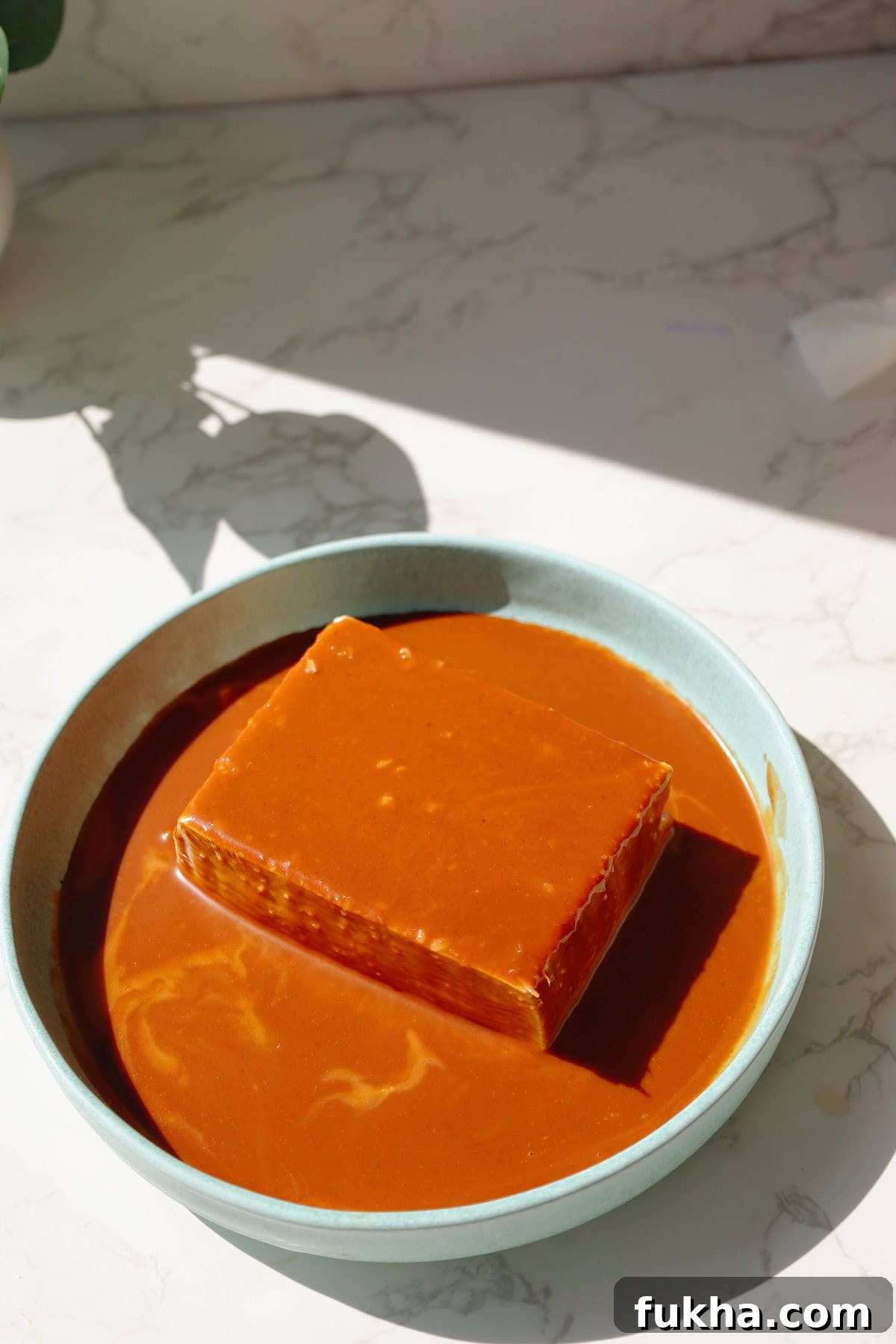 Step four: spoon the sauce over the tofu.