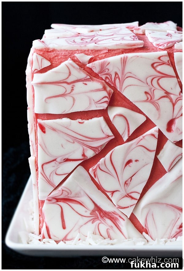 Pink Cake With Chocolate Decoration on White Dish