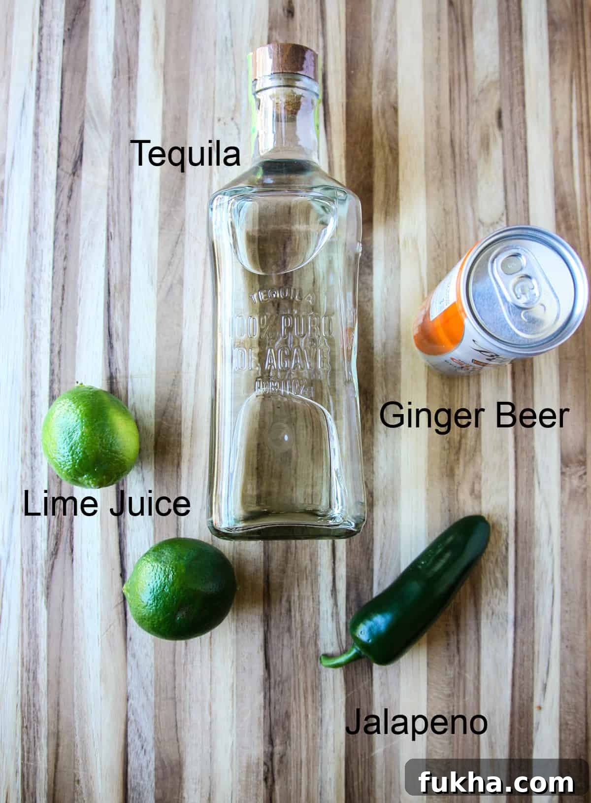 The ingredients to make this drink recipe laid out on a wooden board.