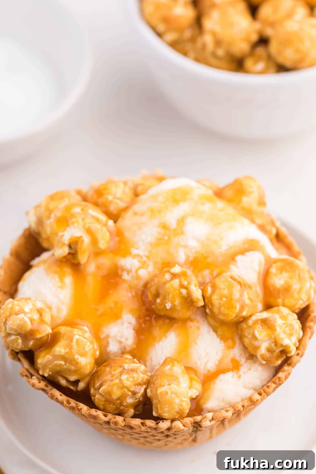Caramel Crunch Ice Cream Sundae Recipe 3 Caramel crunch ice cream sundae on a plate.