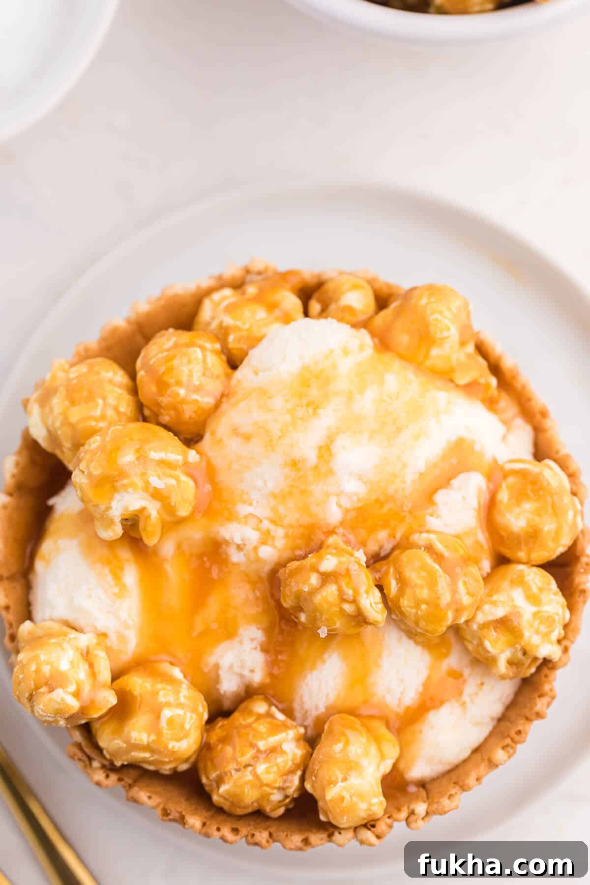 Caramel Crunch Ice Cream Sundae Recipe 5 Caramel crunch ice cream sundae on a plate.
