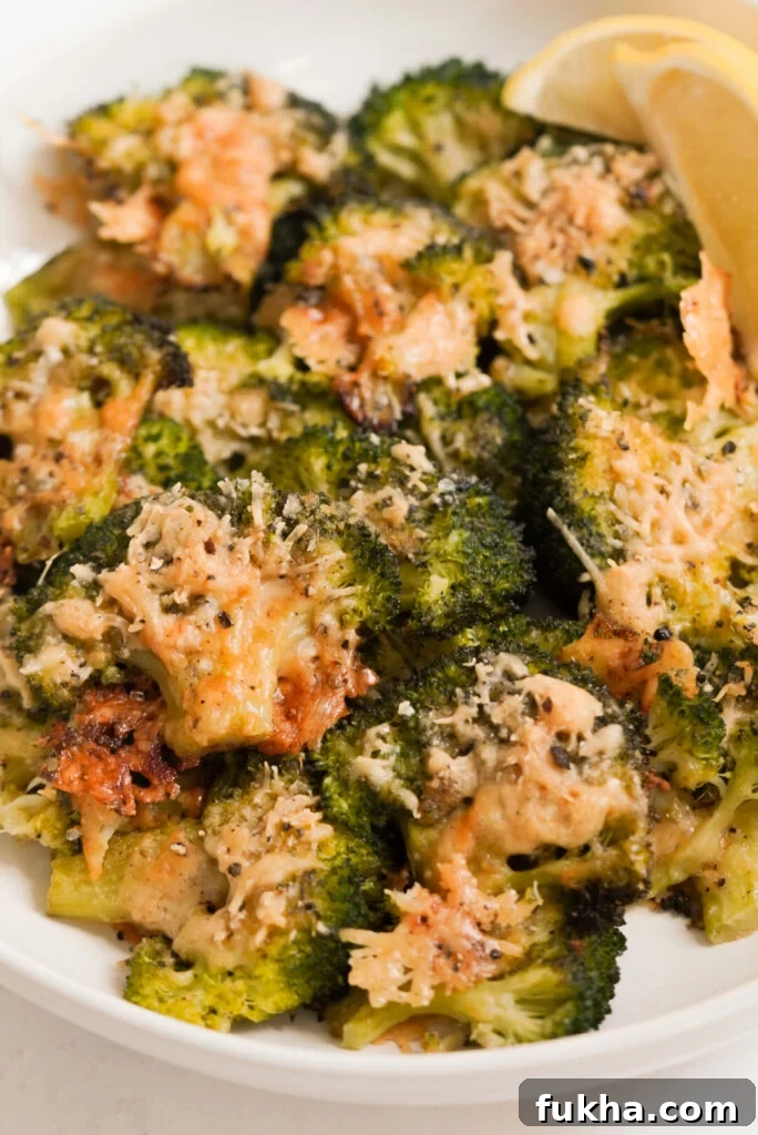 Crispy Smashed Broccoli with Parmesan 2 smashed broccoli parmesan in a bowl.