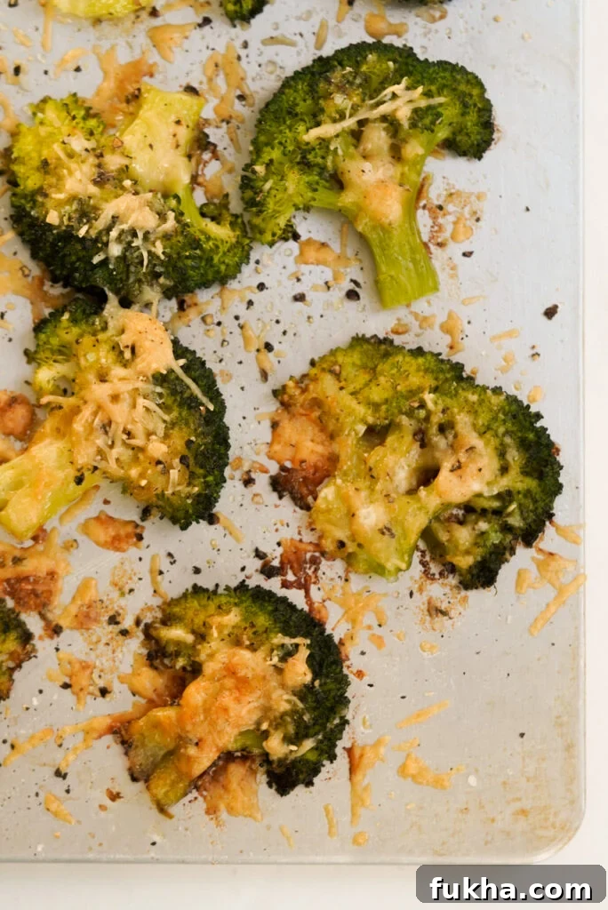 Crispy Smashed Broccoli with Parmesan 6 flat lay shot of a baking sheet with parmesan smashed broccoli florets.
