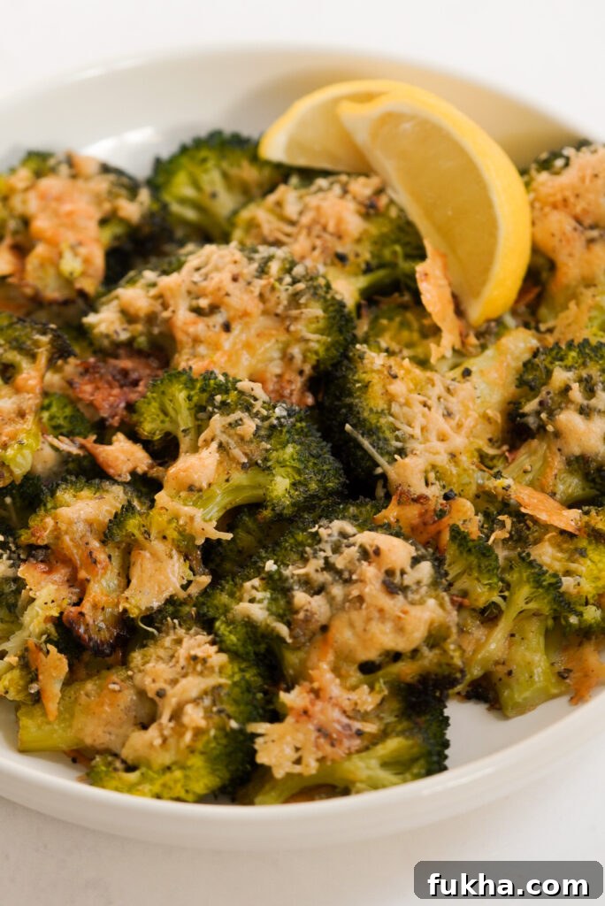 Crispy Smashed Broccoli with Parmesan 9 bowl of smashed broccoli with parmesan cheese and lemon.