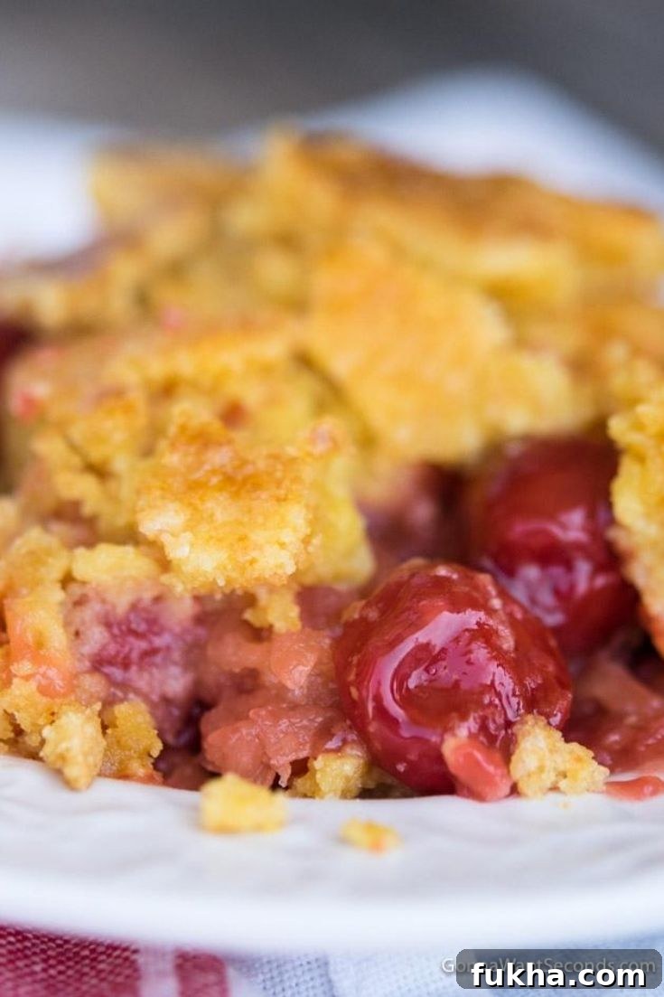 Cherry pineapple dump cake on a plate