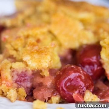 Cherry pineapple dump cake on a plate