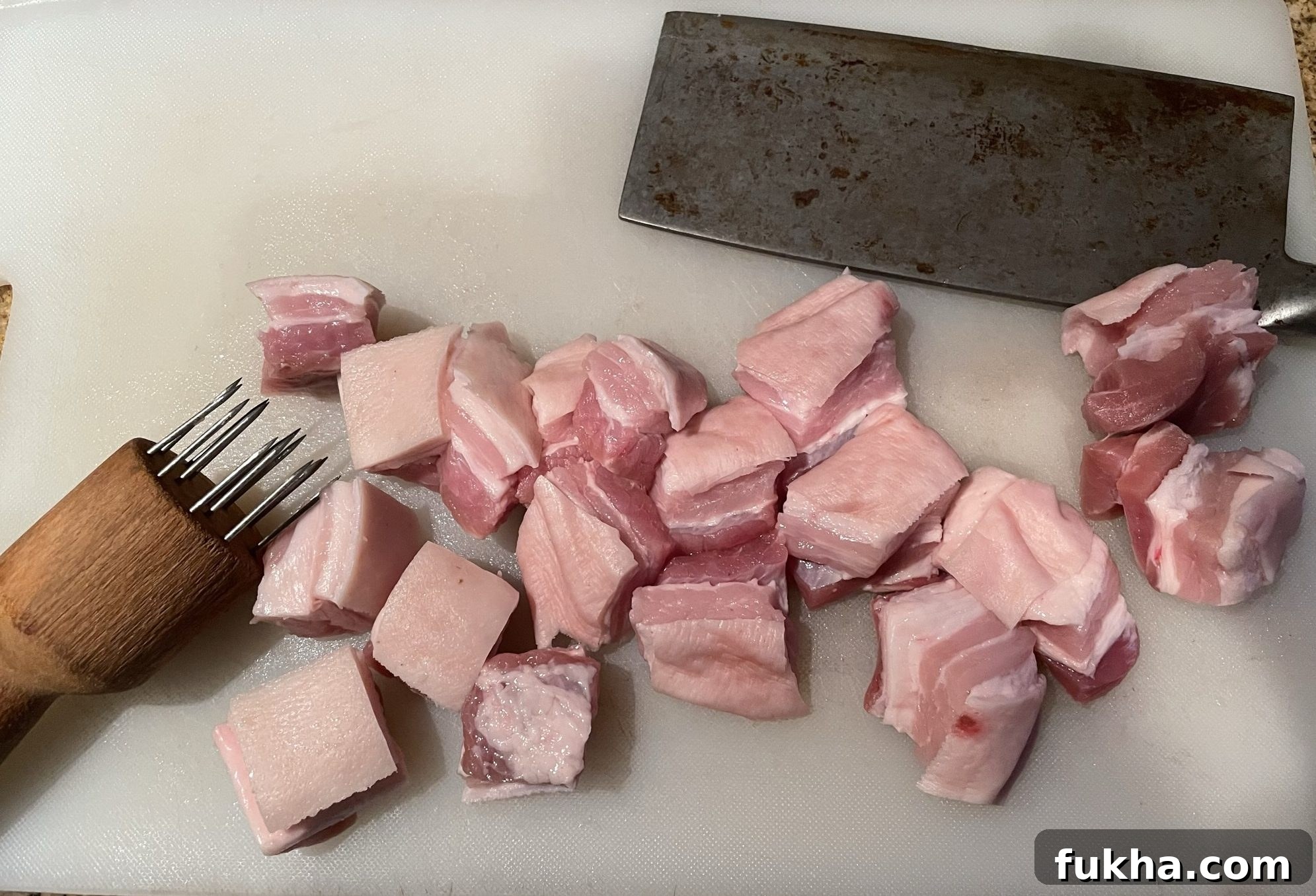 Cubed and tenderized pork belly Cubed and tenderized pork belly