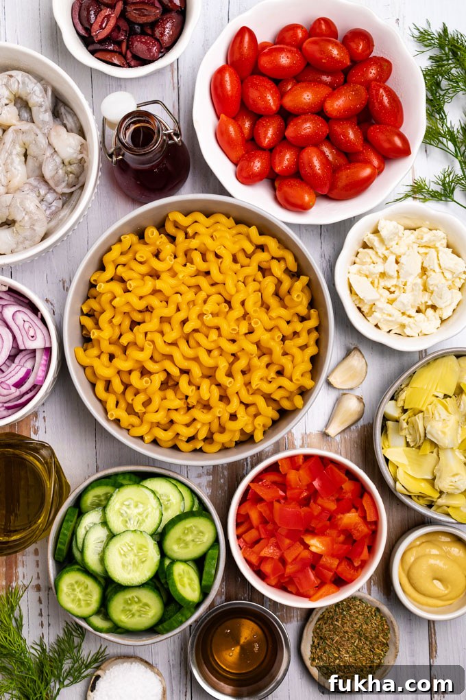 Bowls of ingredients: pasta, cucumbers, tomatoe, red bell pepper, feta cheese, artichoke hearts, shrimp, olives, onion.