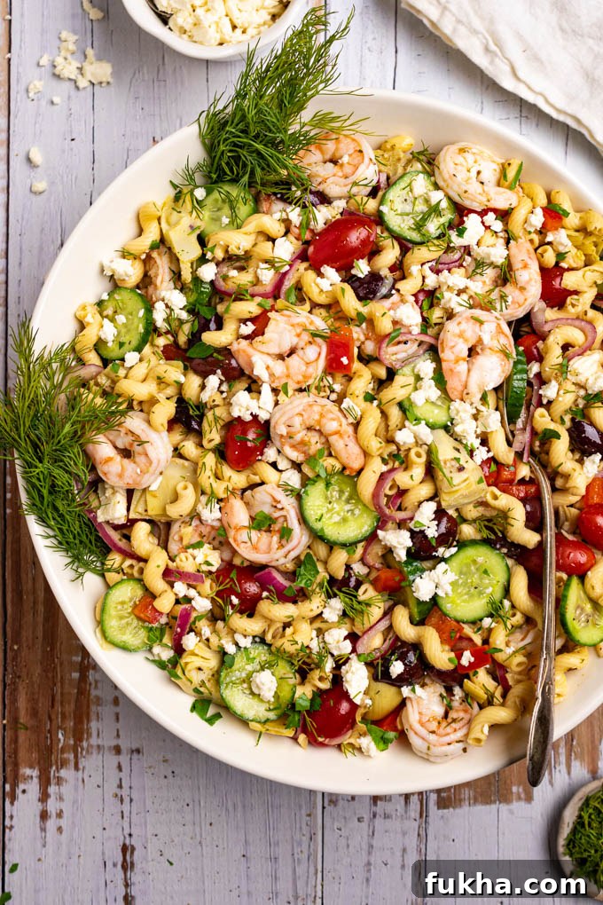 Overhead shot of Greek pasta salad in a large serving bowl.