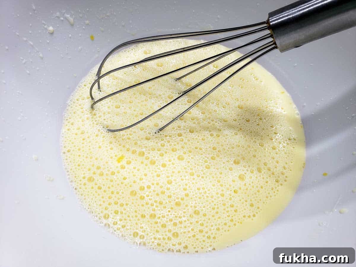 homemade buttermilk and egg whisked in a bowl