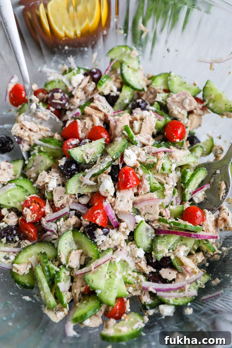 Mediterranean Tuna Salad with Feta and Lemon Vinaigrette 6 A large clear mixing bowl filled with freshly made Mediterranean tuna salad