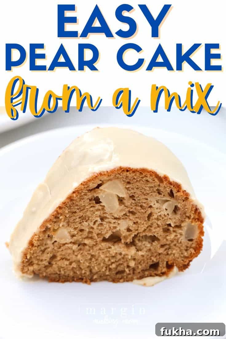 close-up view of a slice of pear cake made from a mix, topped with caramel icing and served on a white plate