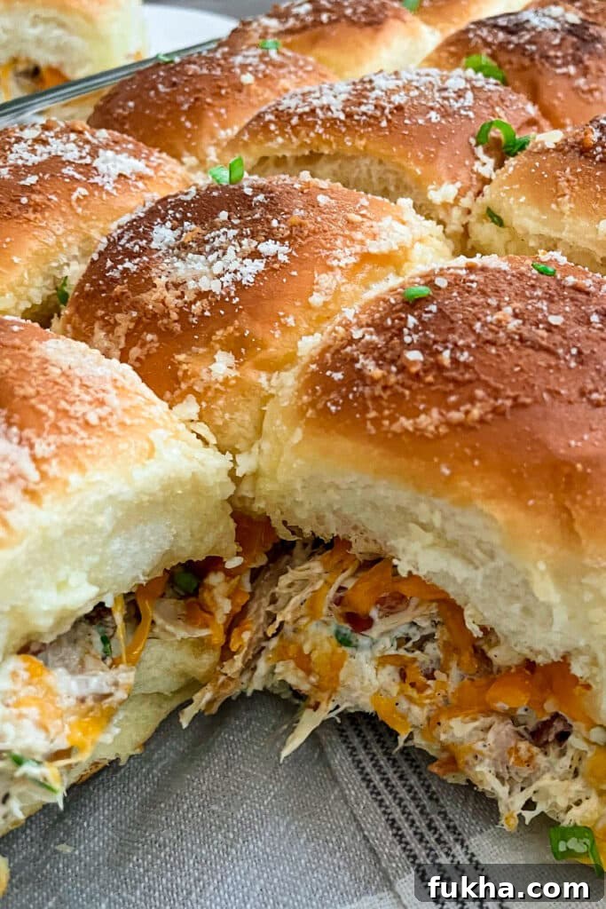 close up photo of crack chicken sliders in a baking dish