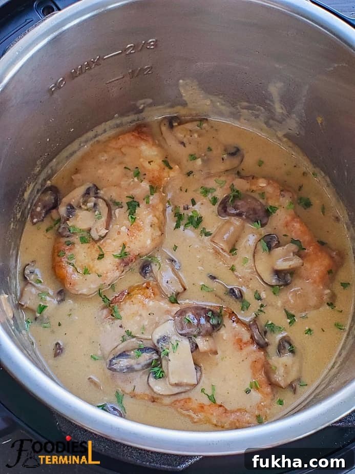 Instant pot pork chop marsala garnished with fresh chopped parsley
