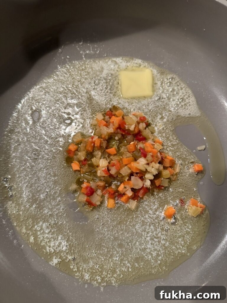Giardiniera and butter sizzling in a pan