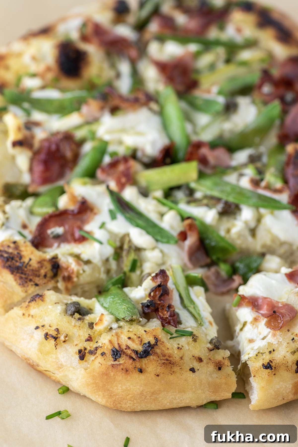 sliced pizza on parchment paper