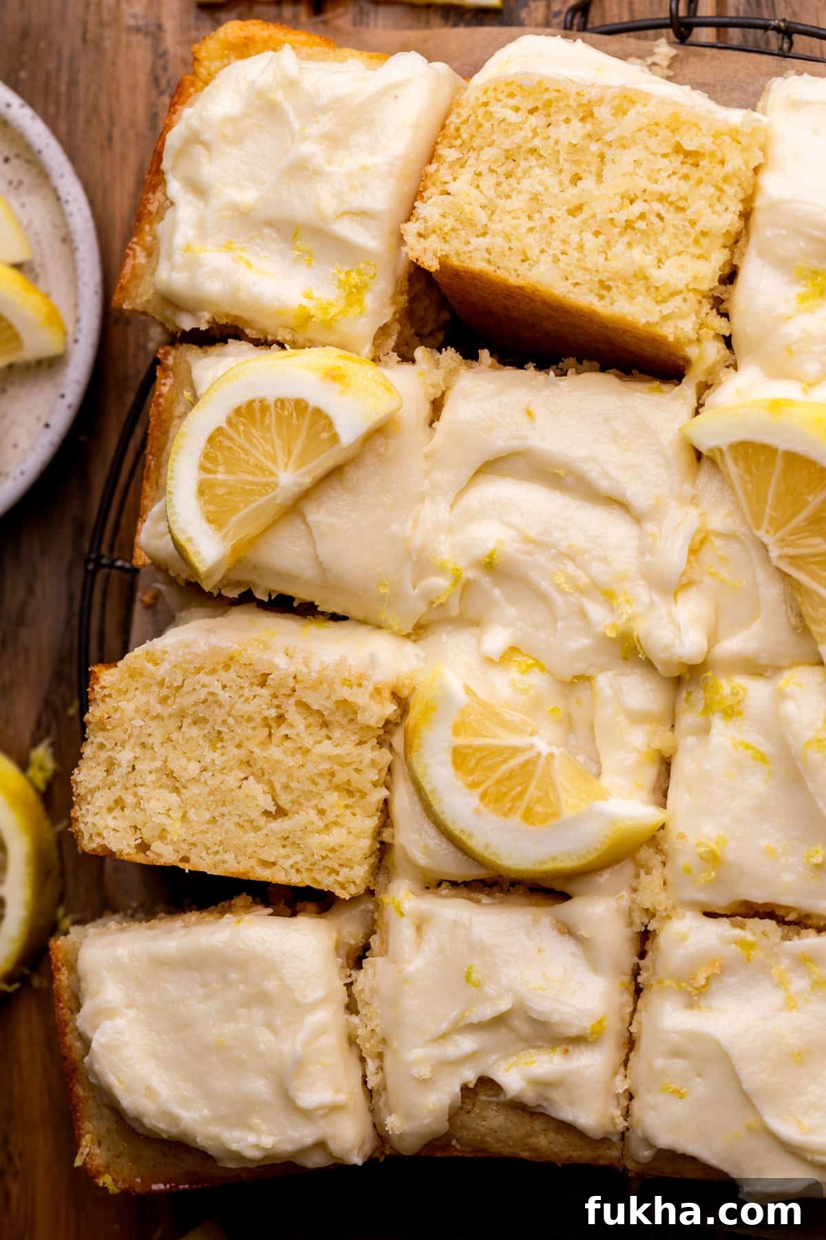 Lemon drizzle cake on a platter.