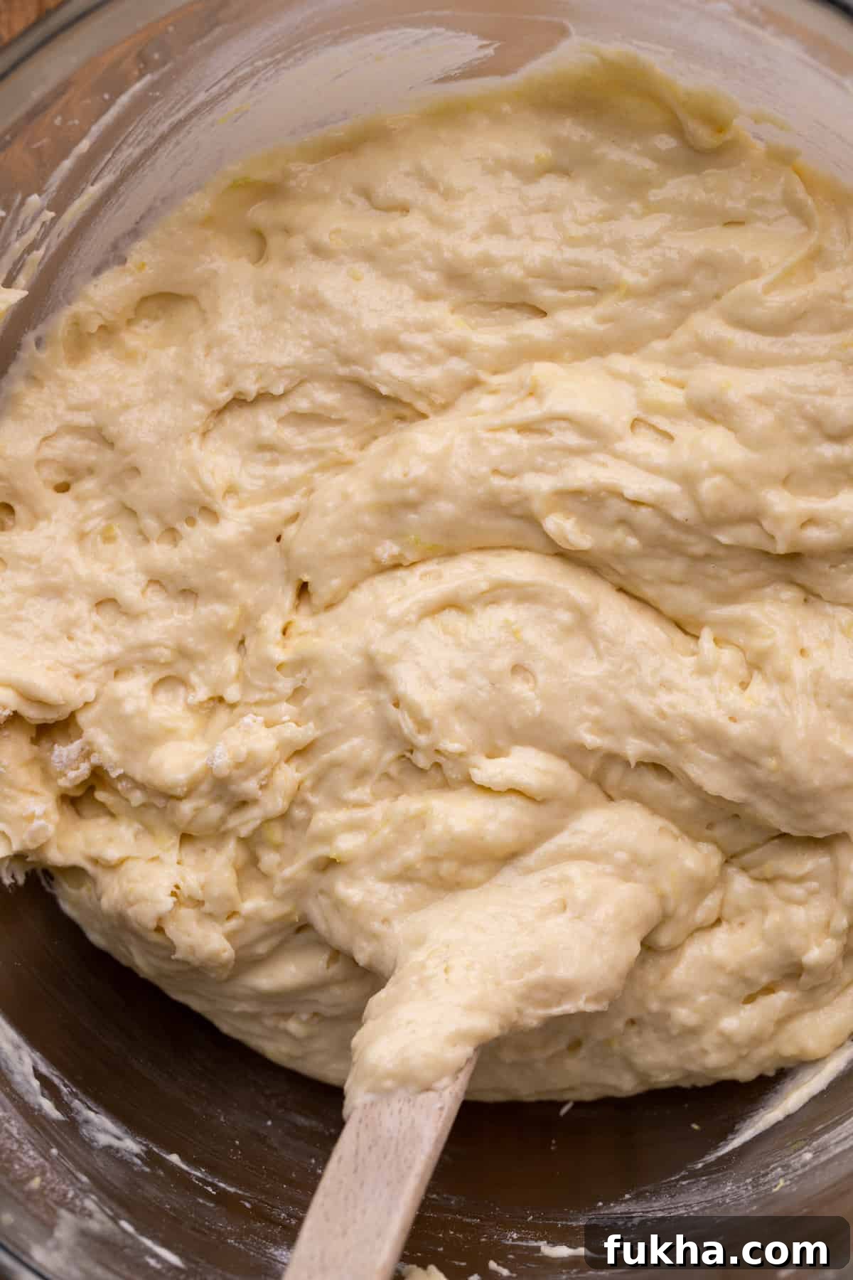 Lemon cake batter in a glass bowl.