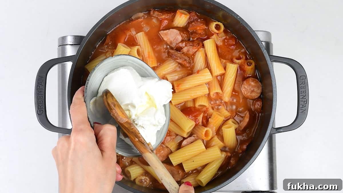 Adding mascarpone to spicy sausage pasta and sauce