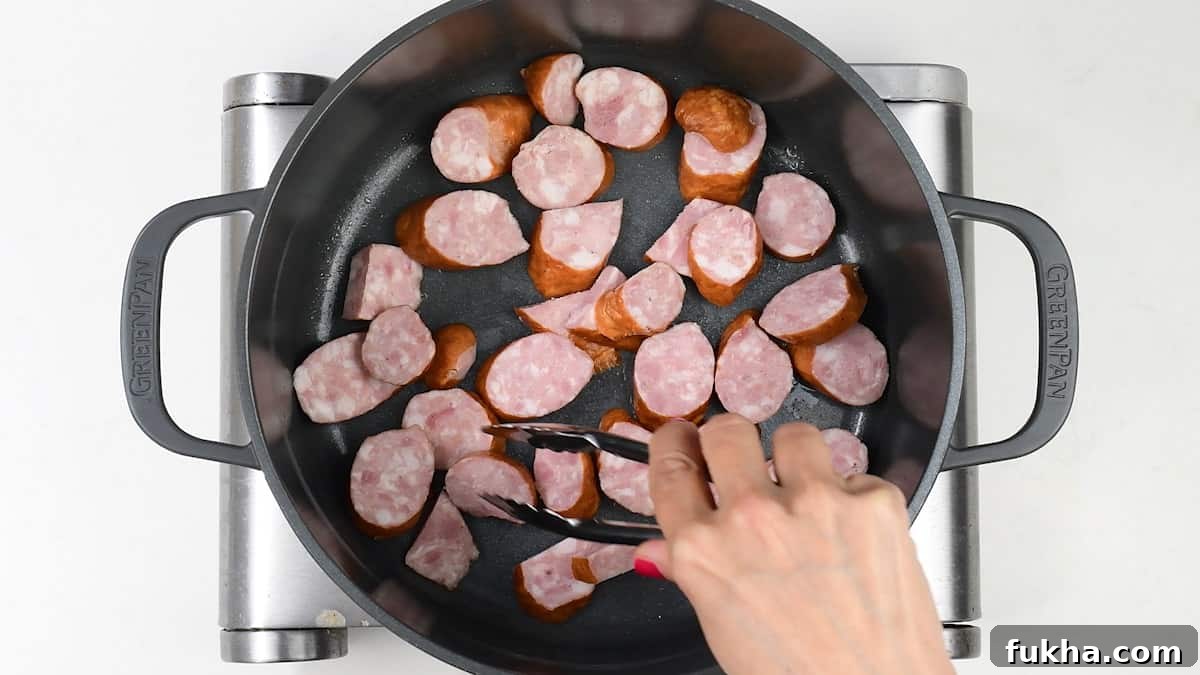 Pan frying sausages in a pot
