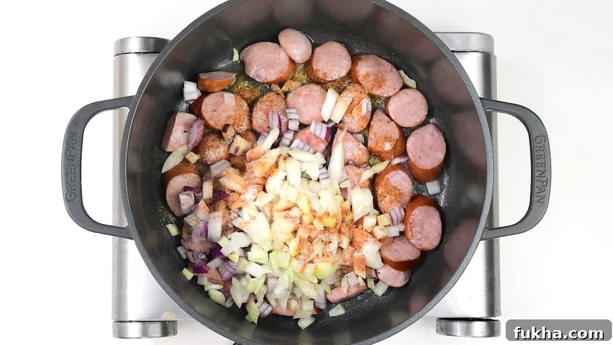 Onions, sausages and seasoning in a pot