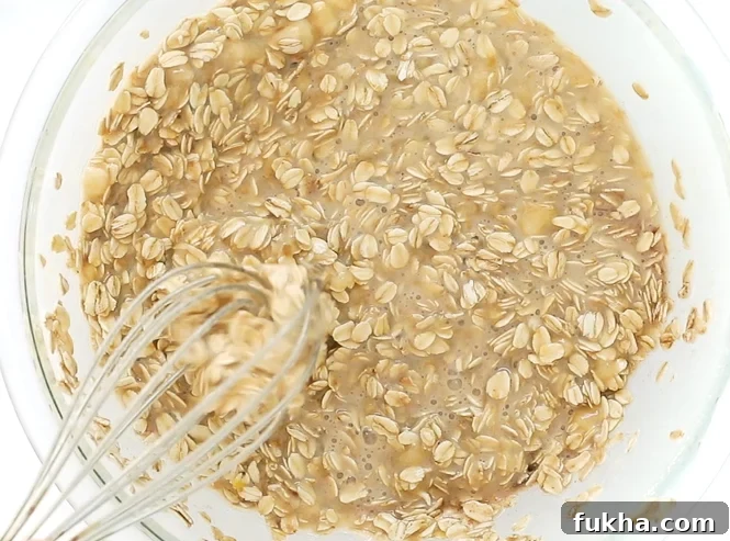 Mixing wet ingredients and dry ingredients together | chefsavvy.com Mixing wet and dry ingredients together with a whisk.
