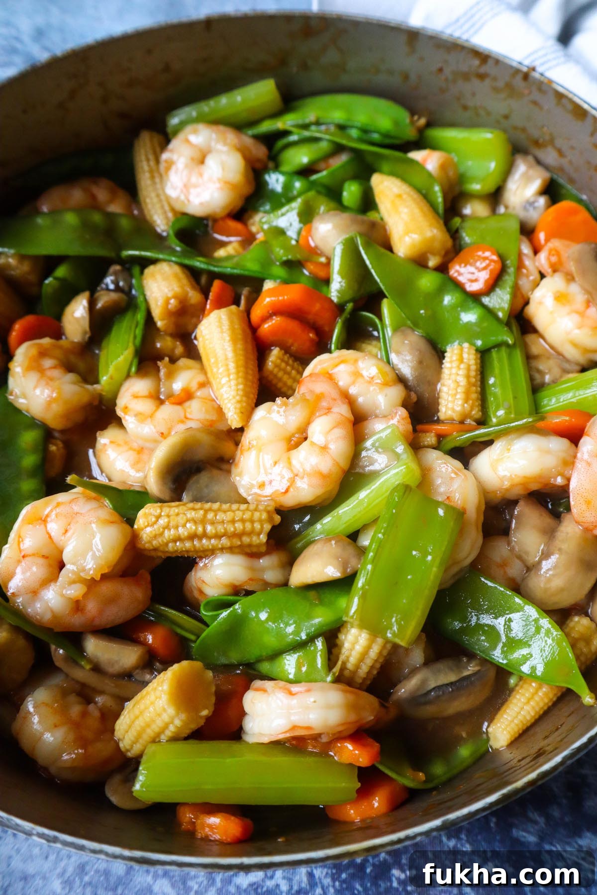 skillet with shrimp chopped suey covered in a savory sauce