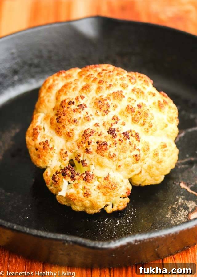 Roasted Whole Cauliflower with Pistachio Herb Sauce - this is so easy to make; you can present the whole roasted cauliflower and break it up at the table