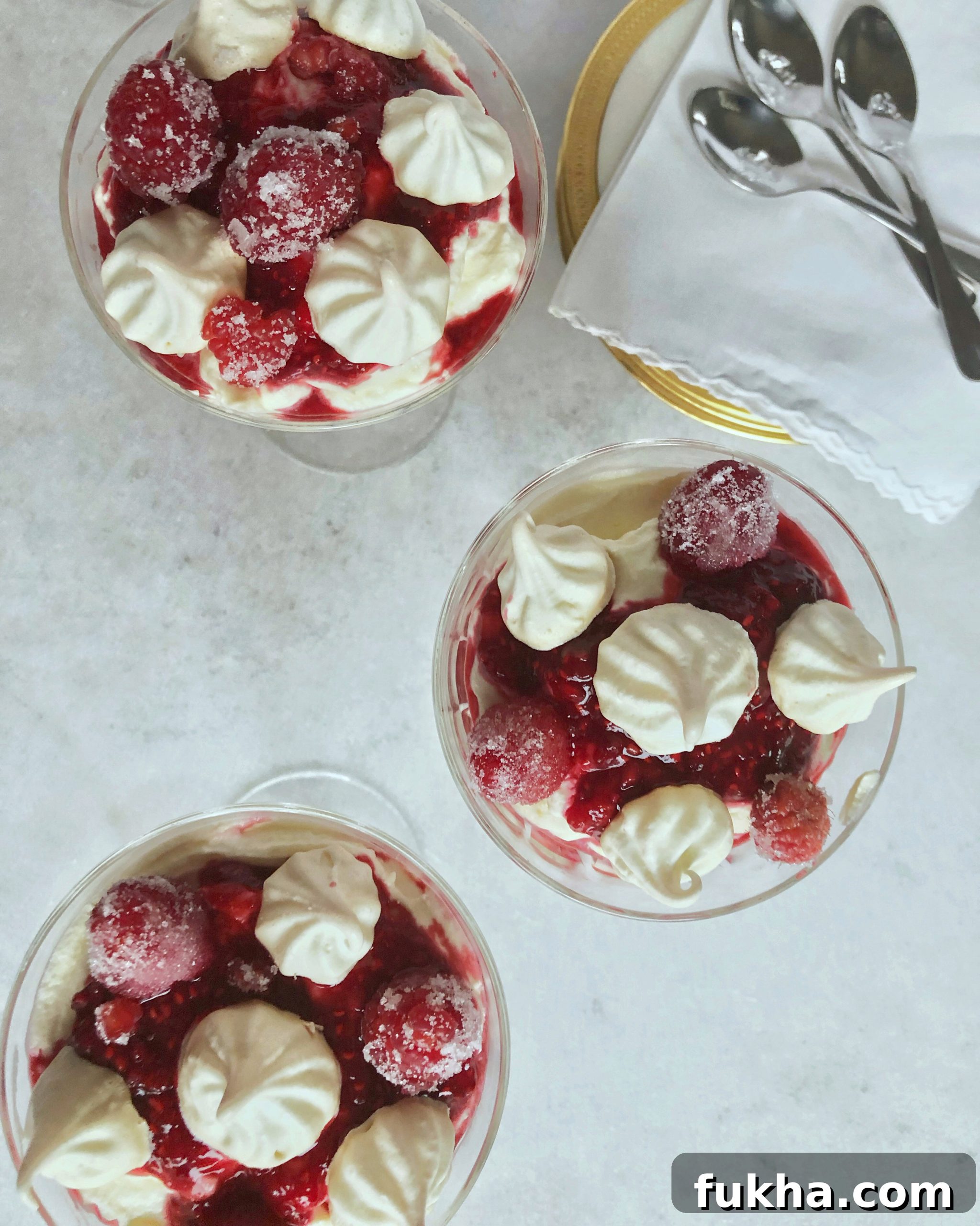 spoons are ready to eat dishes of lemon raspberry kiss parfait