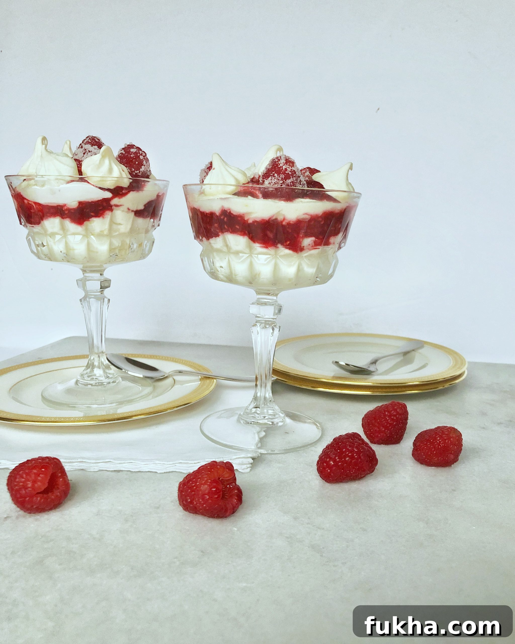 dessert dishes full of lemon raspberry kiss parfait and fresh raspberries