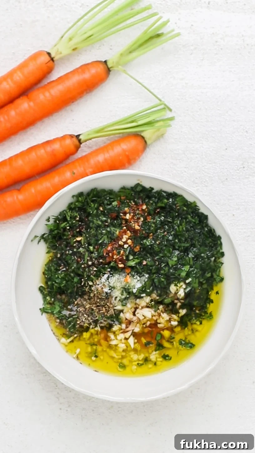 The ingredients of a chimichurri shown being added to a small dish.