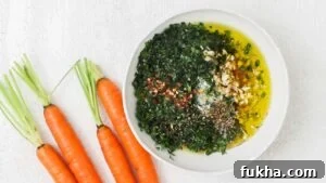 Very finely chop carrot tops, Italian parsley, and garlic. Add to a bowl.