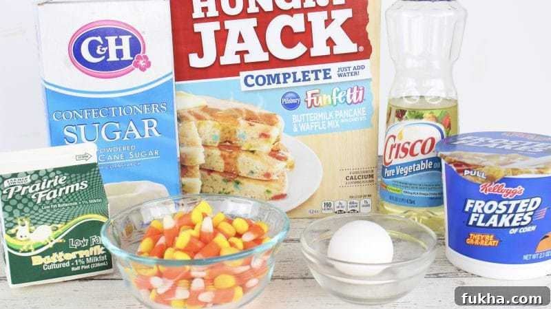 Confectioners sugar, buttermilk, candy corn, egg, vegetable oil, frosted flakes, and box of Funfetti pancake mix.