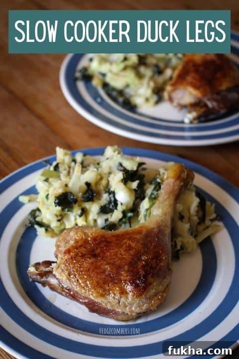 Two stripy plates with slow cooked crispy duck legs and mash