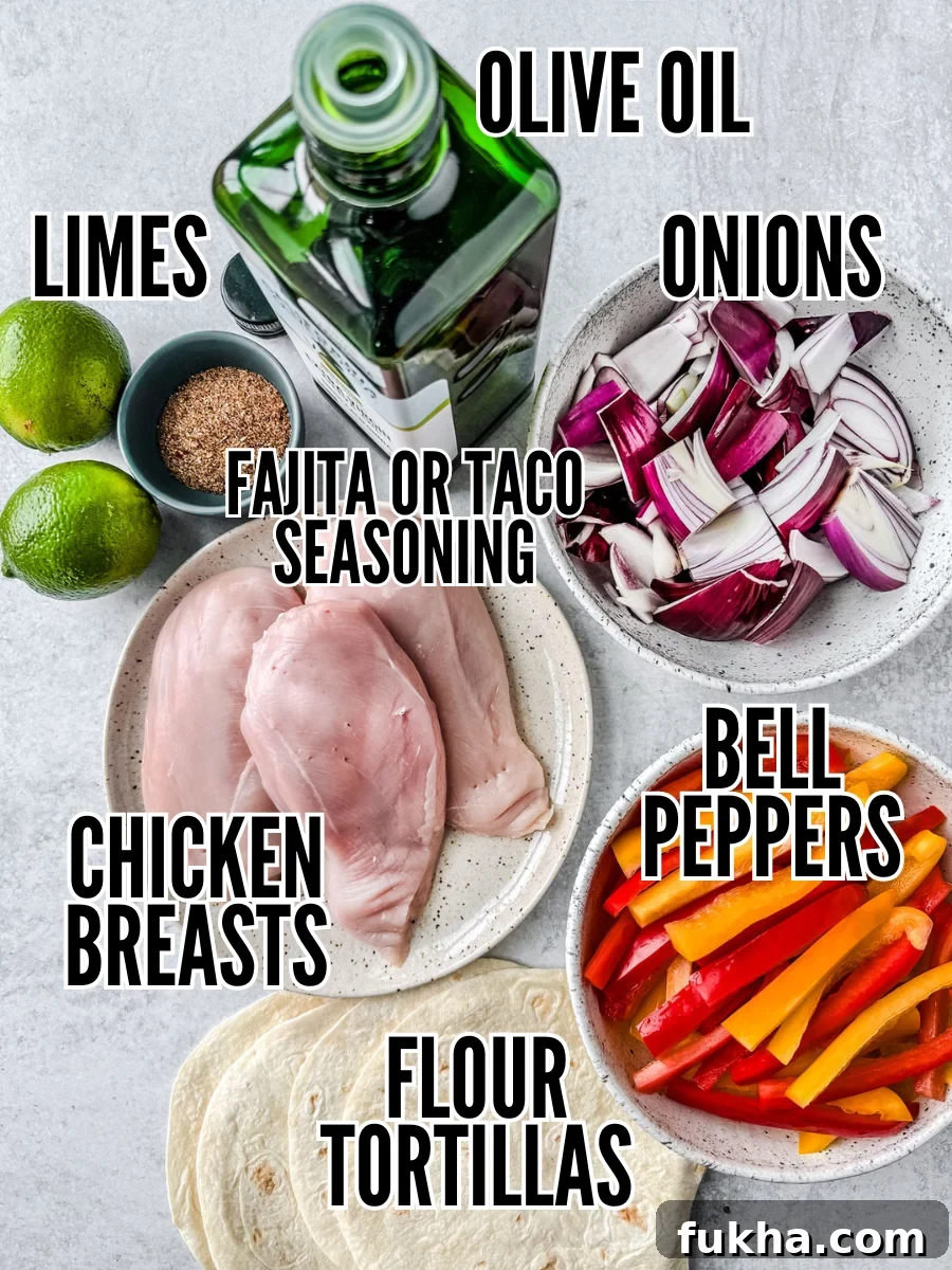Ingredients for chicken fajitas on a light background.