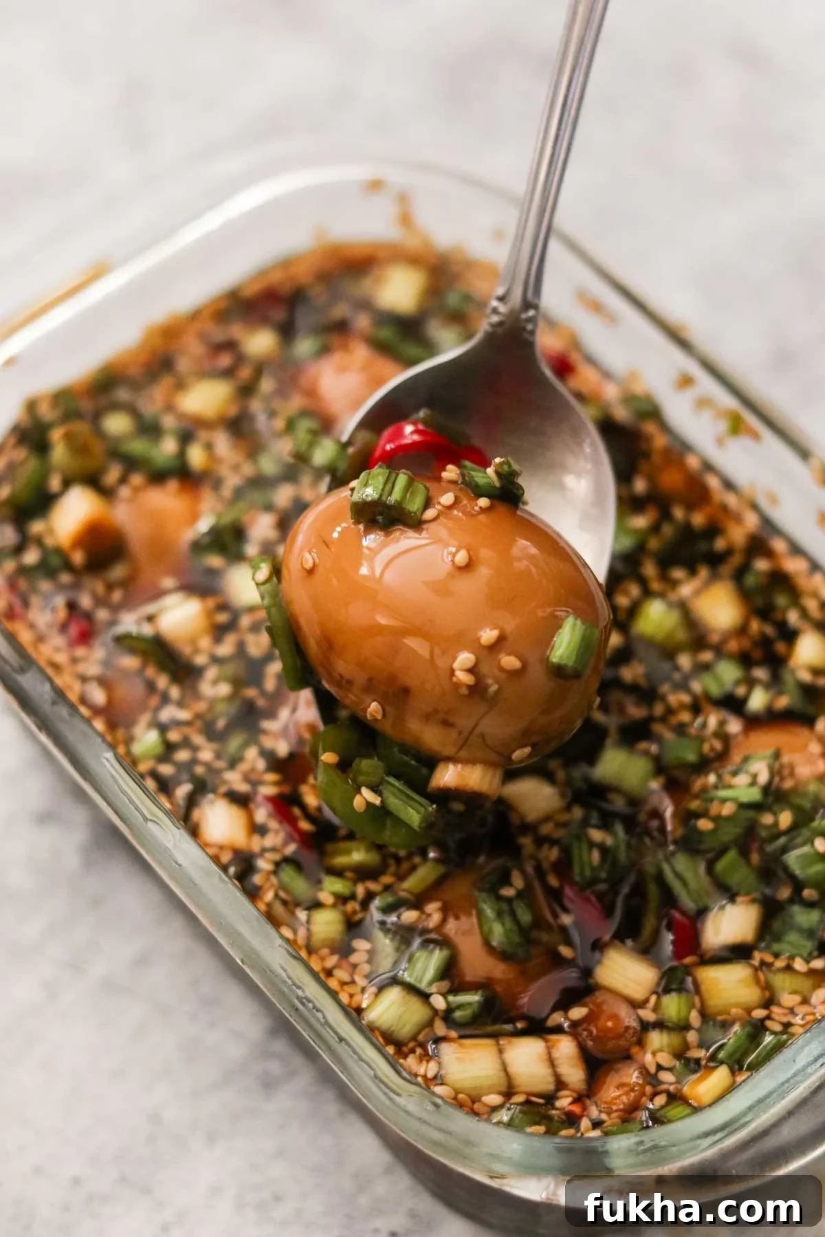 Removing a soft boiled egg from the marinade
