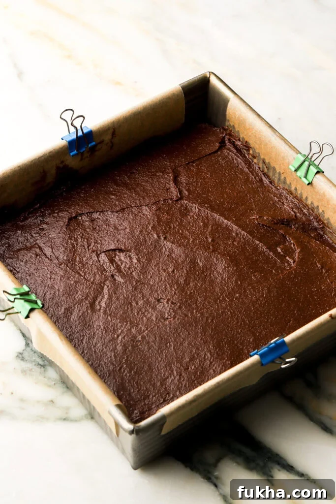 the rest of the brownie batter spread on top of the lady fingers